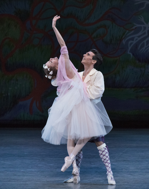 De Luz holds onto Hyltin's waist was she executes a backend on one en point. Her tulle romantic-style tutu is volumnious.